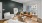 a living room with a fan and couches