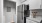 a kitchen with a black refrigerator