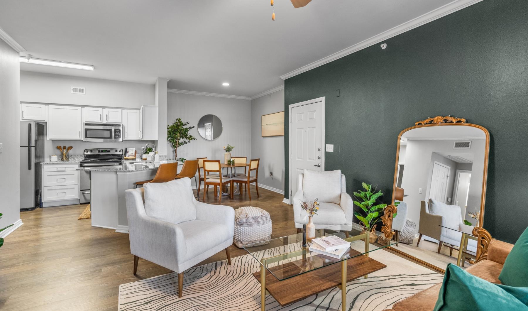 Find your perfect fit at Vue 360 Apartments a room with a table and chairs